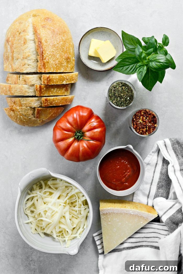 Margherita Toast Pizzas 4 Ingredients for Margherita Pizza Toast laid out on a wooden board