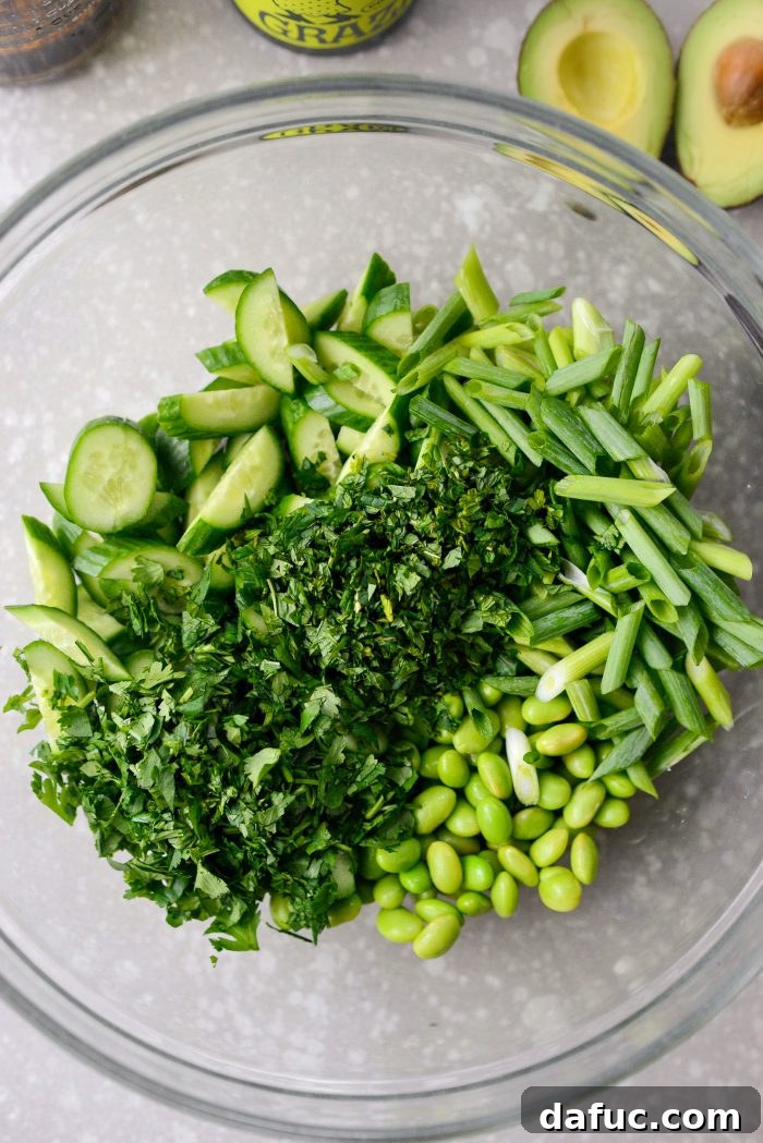 Zesty Crisped Rice Medley 12 Adding chopped vegetables and herbs to a large bowl