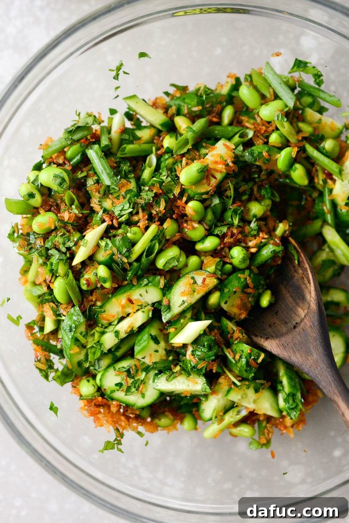 Zesty Crisped Rice Medley 14 Tossing salad ingredients gently to combine