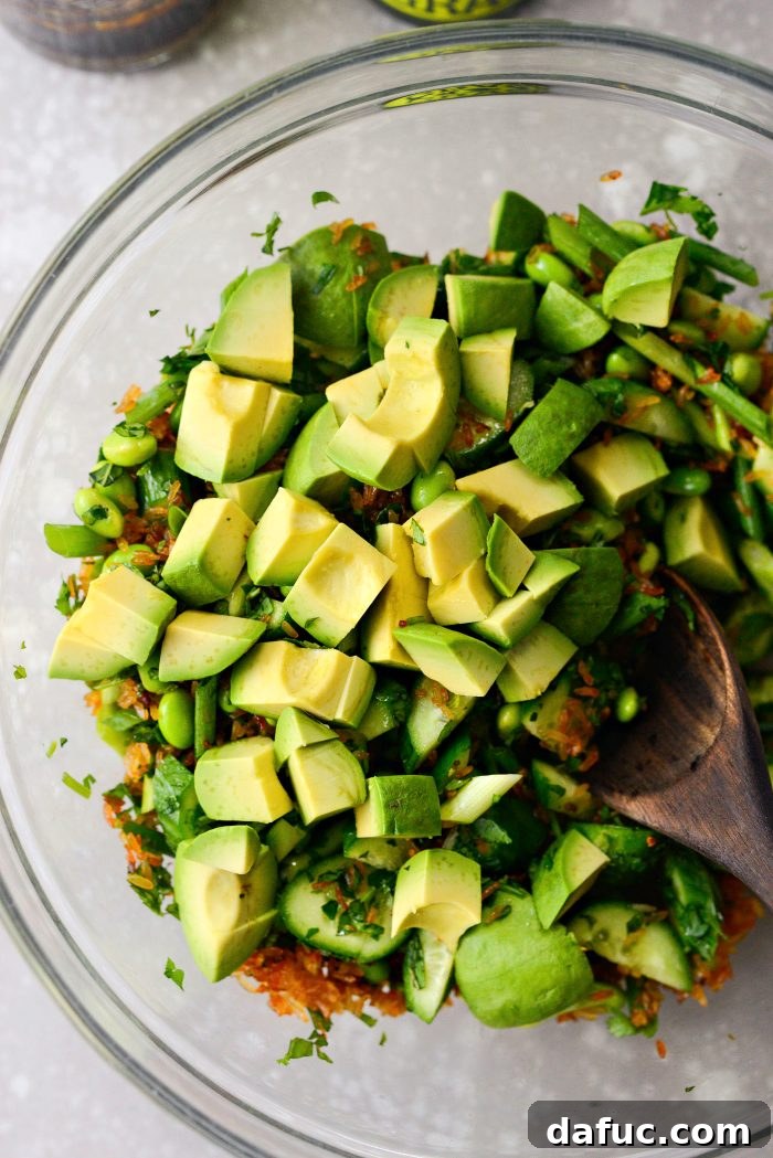 Zesty Crisped Rice Medley 15 Adding diced avocado to the mixed salad