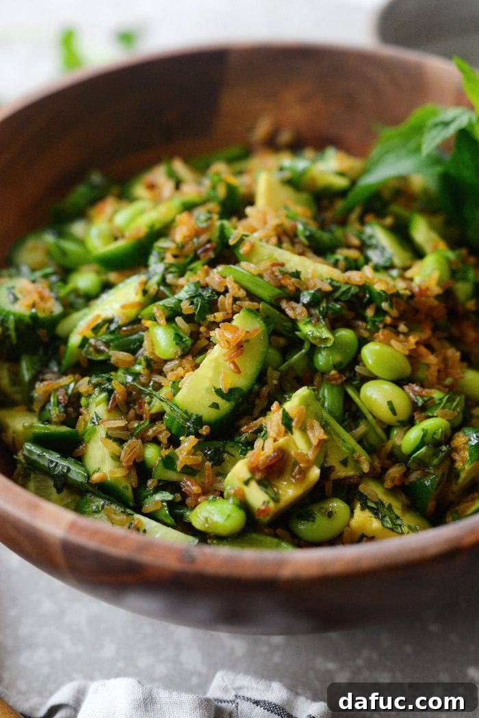 Zesty Crisped Rice Medley 3 Close-up of Crispy Rice Salad with vibrant green herbs and creamy avocado