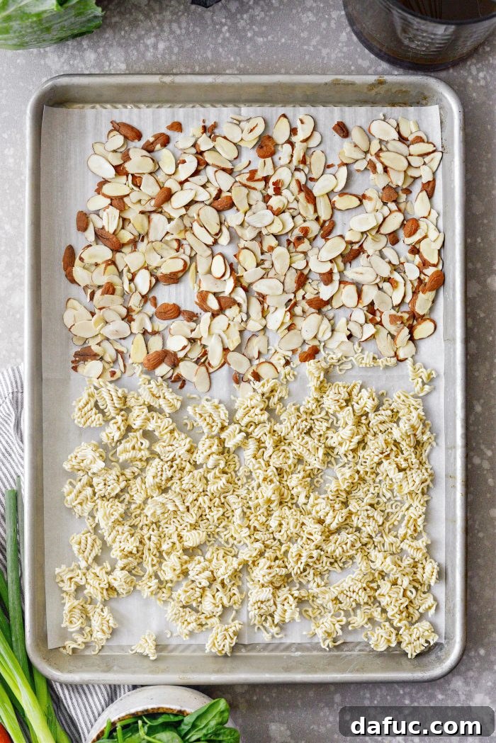 Crispy Asian Ramen Salad 7 add nuts and ramen to lined rimmed baking sheet