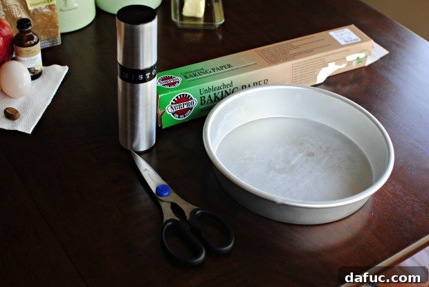 Parchment paper laid out flat with a cake pan centered for tracing