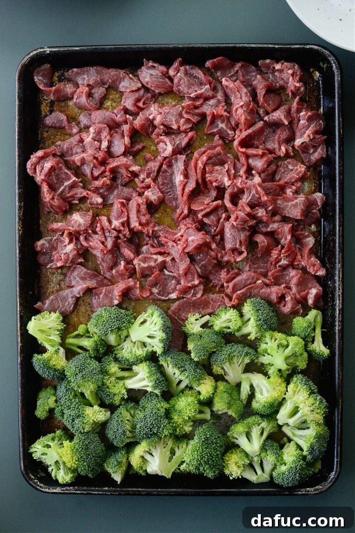 Sheet Pan Steak and Broccoli 9 Beef and broccoli arranged on a sheet pan, ready for the oven