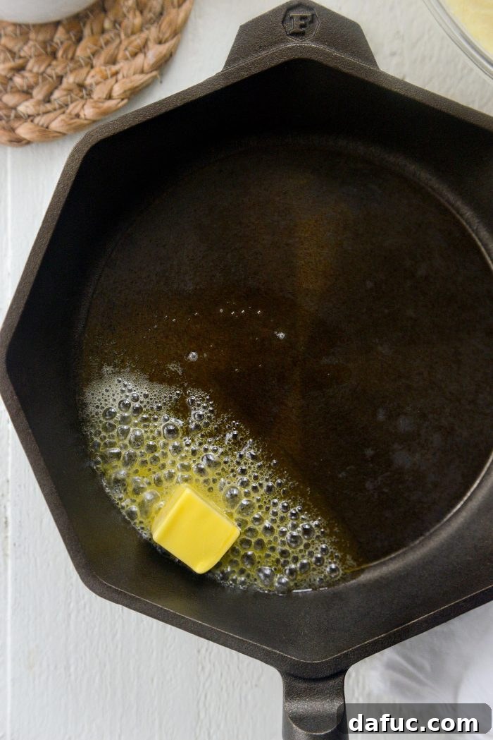 Honey Butter Glazed Golden Cornbread 13 remove hot skillet from oven and add butter