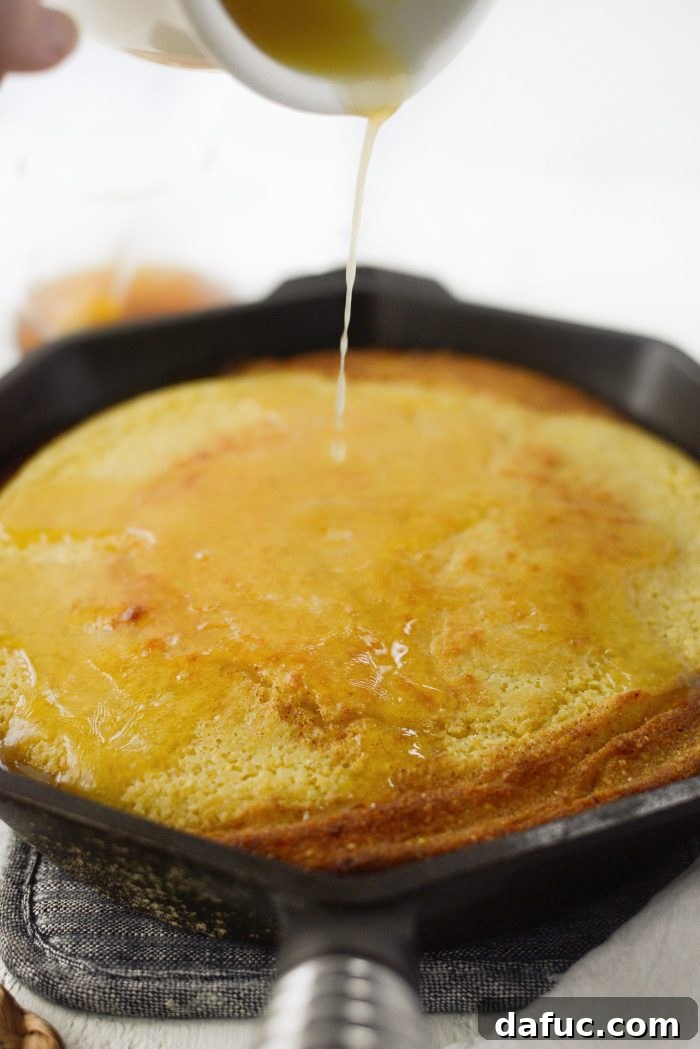 Honey Butter Glazed Golden Cornbread 16 pour honey butter overtop