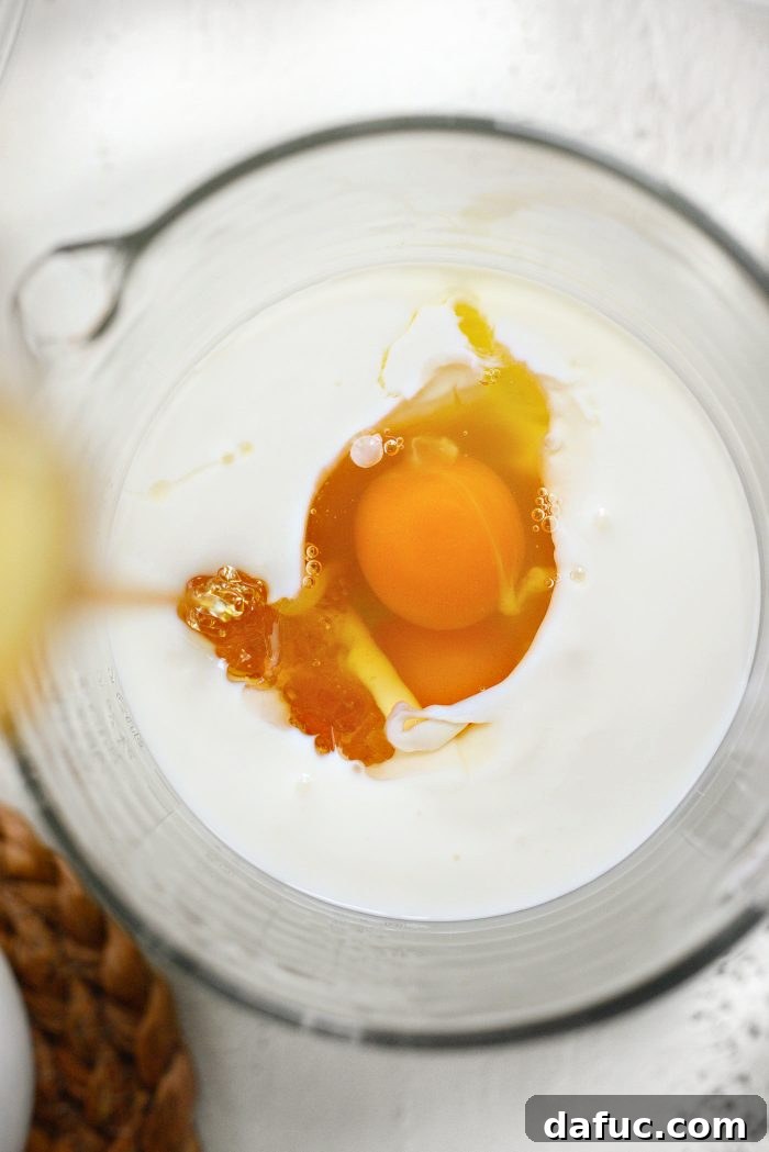 Honey Butter Glazed Golden Cornbread 7 combine wet ingredients