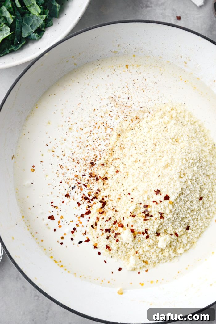Add Parmesan cheese, lemon juice, red pepper flakes, and grated nutmeg to the cream sauce