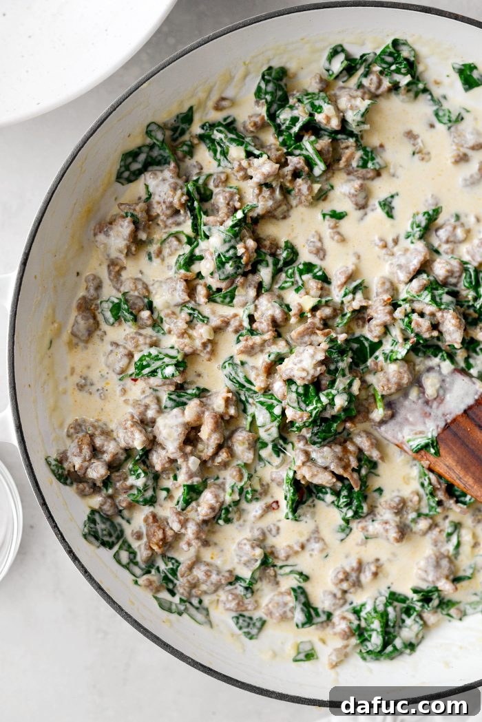 Stir the cooked sausage mixture back into the pan with the sauce and kale
