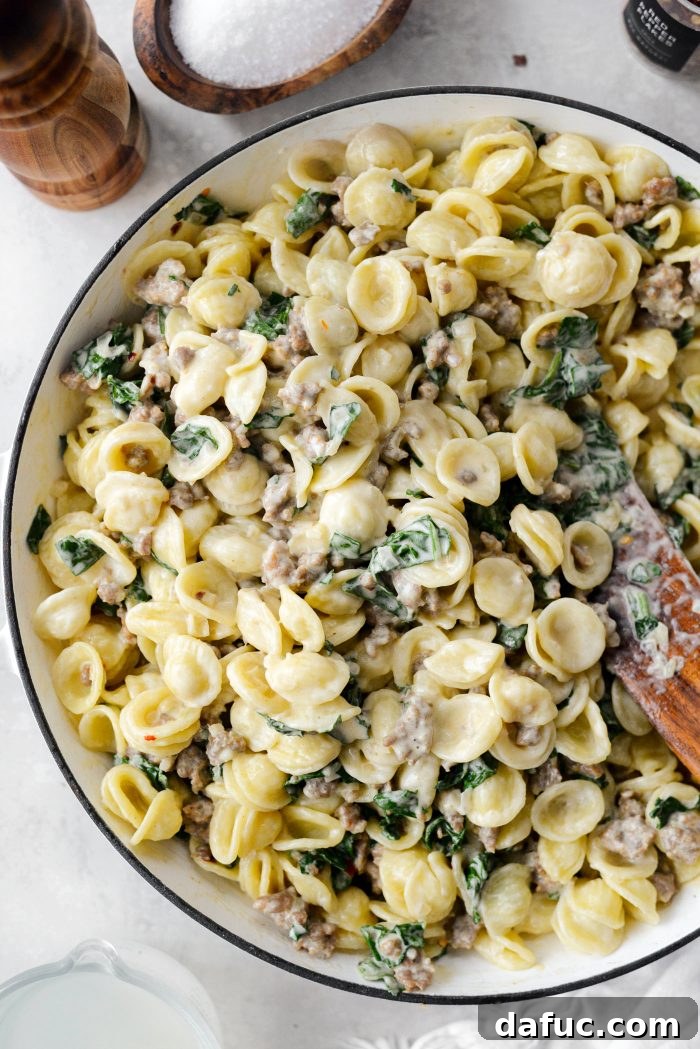 Add cooked orecchiette pasta and reserved pasta water to the pan