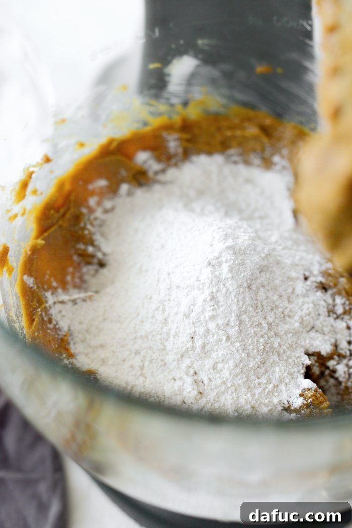 Zesty Orange Cardamom Cookies 14 Gradually adding dry ingredients to the wet mixture