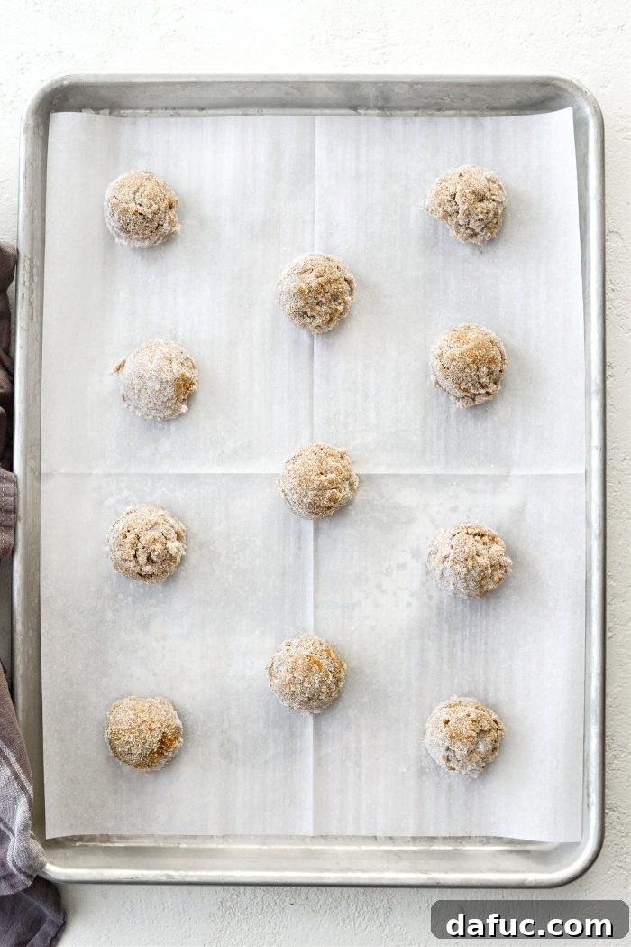 Zesty Orange Cardamom Cookies 19 Arranging sugared cookie dough on a parchment-lined baking sheet