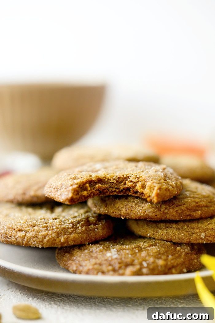 Zesty Orange Cardamom Cookies 25 A stack of three Orange Cardamom Cookies