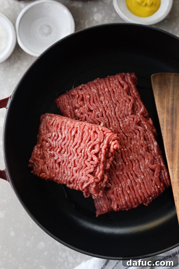 Sauce ingredients added to browned ground beef