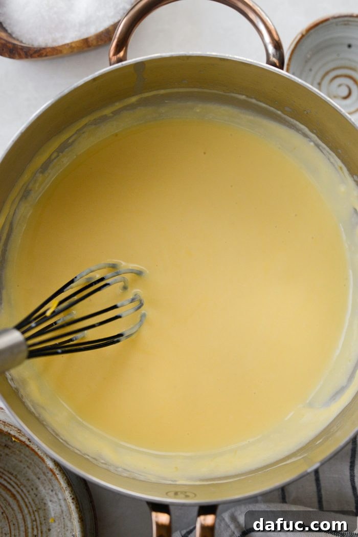 Whisk cheese sauce until smooth