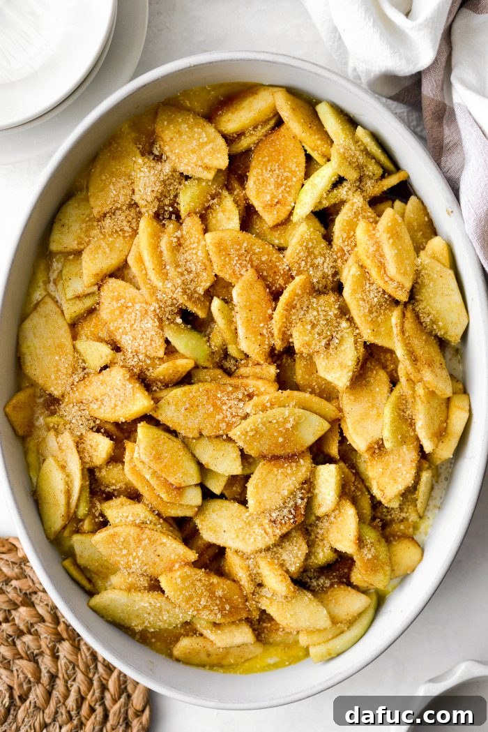 Homemade Apple Cobbler Delight 14 Sprinkling turbinado sugar on top of Apple Cobbler