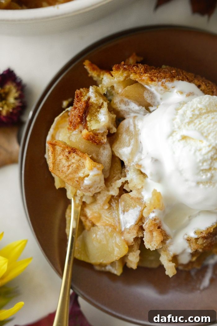 Homemade Apple Cobbler Delight 19 Apple Cobbler with a white spoon