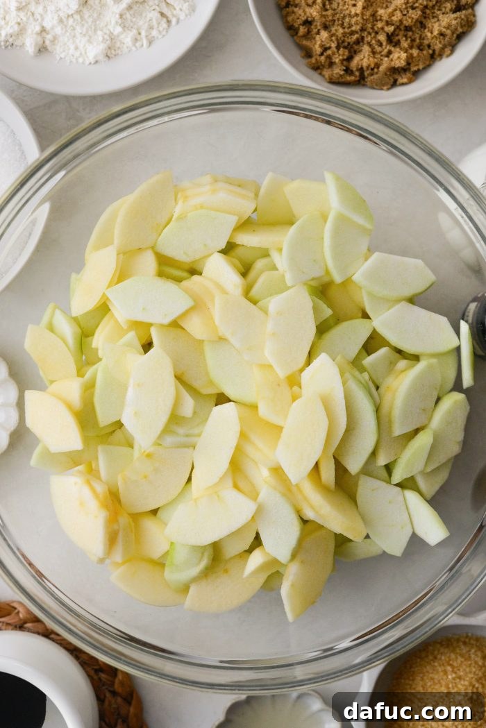 Homemade Apple Cobbler Delight 6 Sliced apples in a mixing bowl