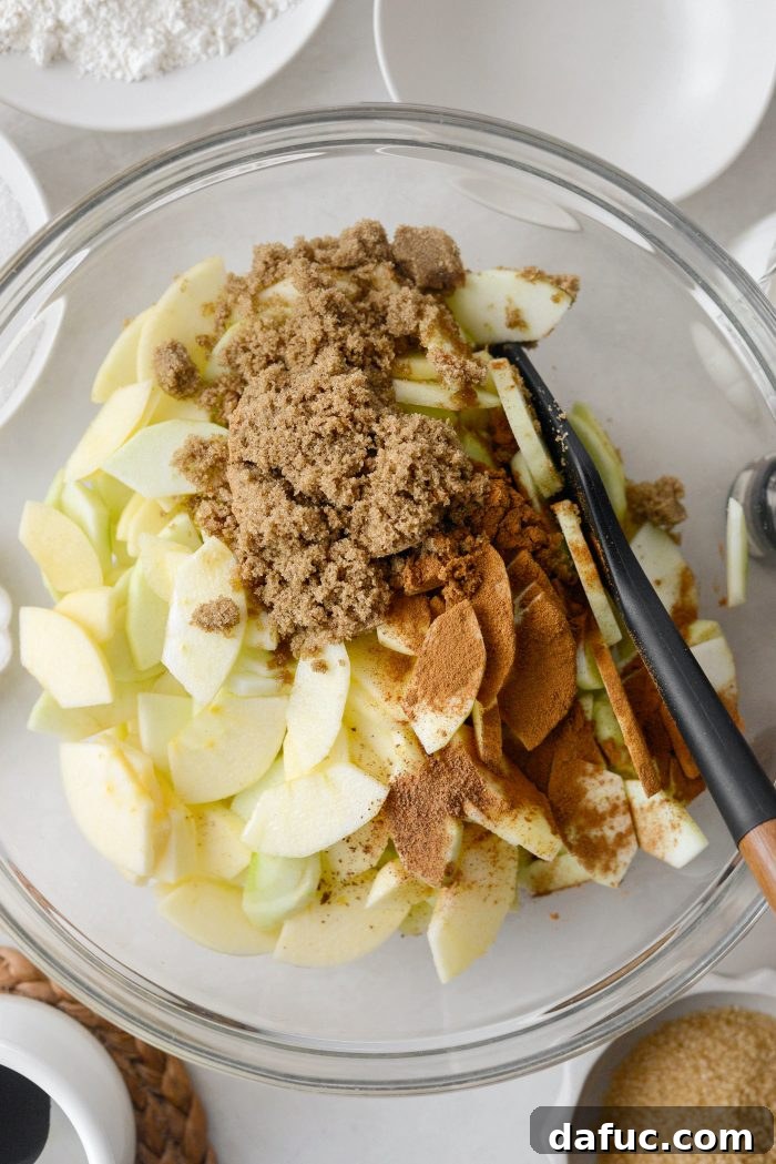 Homemade Apple Cobbler Delight 7 Adding lemon juice, brown sugar, and spices to apples