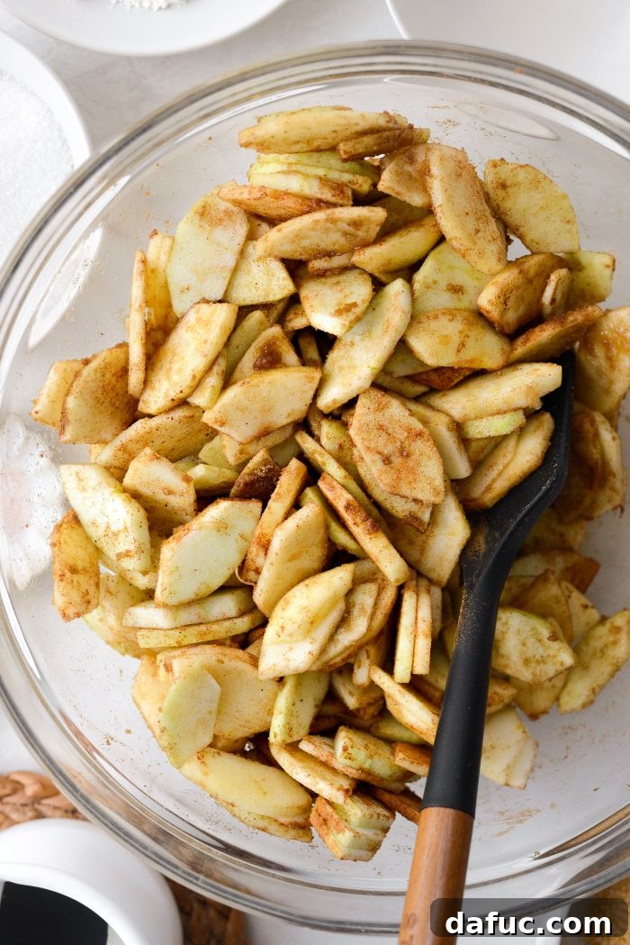 Homemade Apple Cobbler Delight 8 Tossing apples with spices to combine