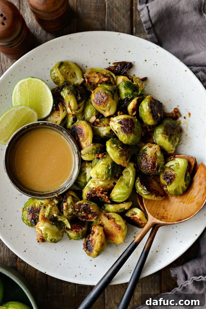 Finished Miso Glazed Roasted Brussels Sprouts served in a rustic iron skillet