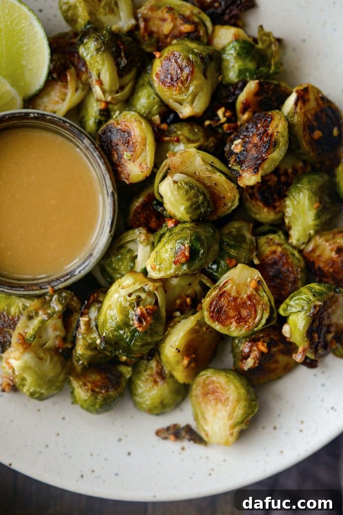 Miso Glazed Roasted Brussels Sprouts artfully arranged in a ceramic bowl, ready to be served