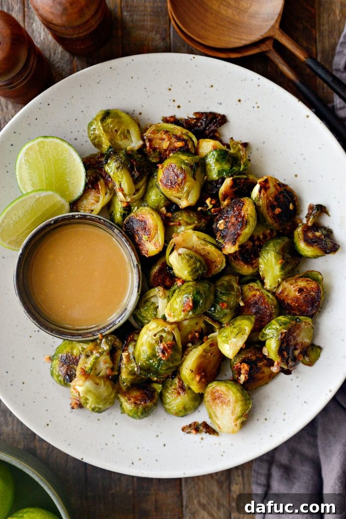 Close-up of golden brown Miso Glazed Roasted Brussels Sprouts in a serving bowl