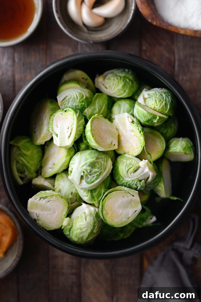 Freshly trimmed and halved Brussels sprouts ready for roasting