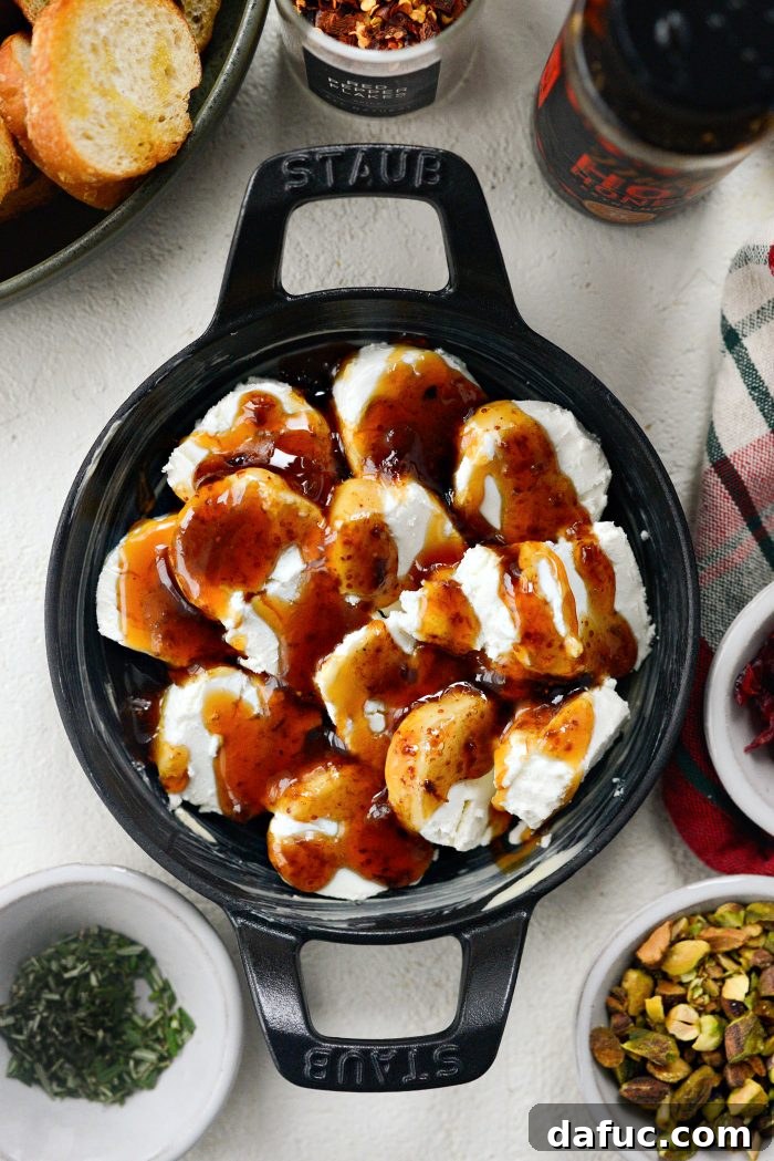 Chili Honeyed Chèvre Indulgence 8 Drizzling hot honey or regular honey over the fig jam and goat cheese layers.
