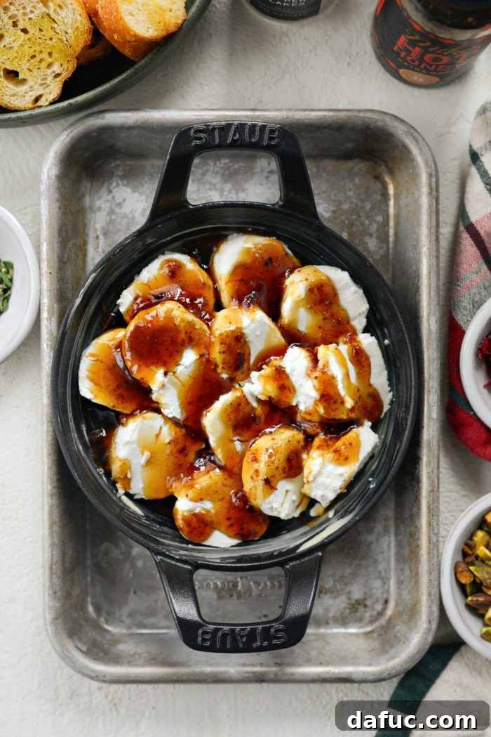 Chili Honeyed Chèvre Indulgence 9 The Hot Honey Goat Cheese Dip baking in the oven for 20 minutes until bubbly and golden.