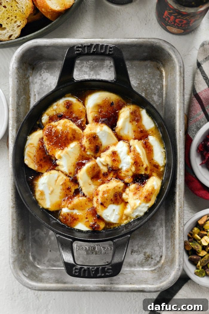 Chili Honeyed Chèvre Indulgence 10 Freshly baked Hot Honey Goat Cheese Dip, hot and bubbling out of the oven.