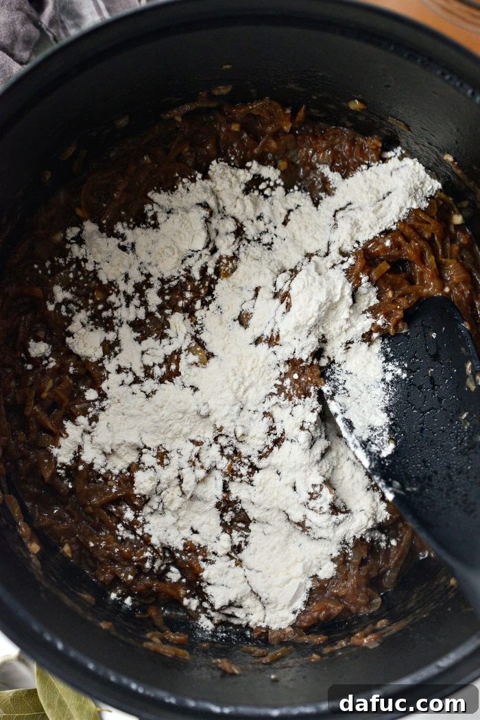 Sweet Onion Braised Beef 14 Sprinkling all-purpose flour into the caramelized onions and reduced wine.