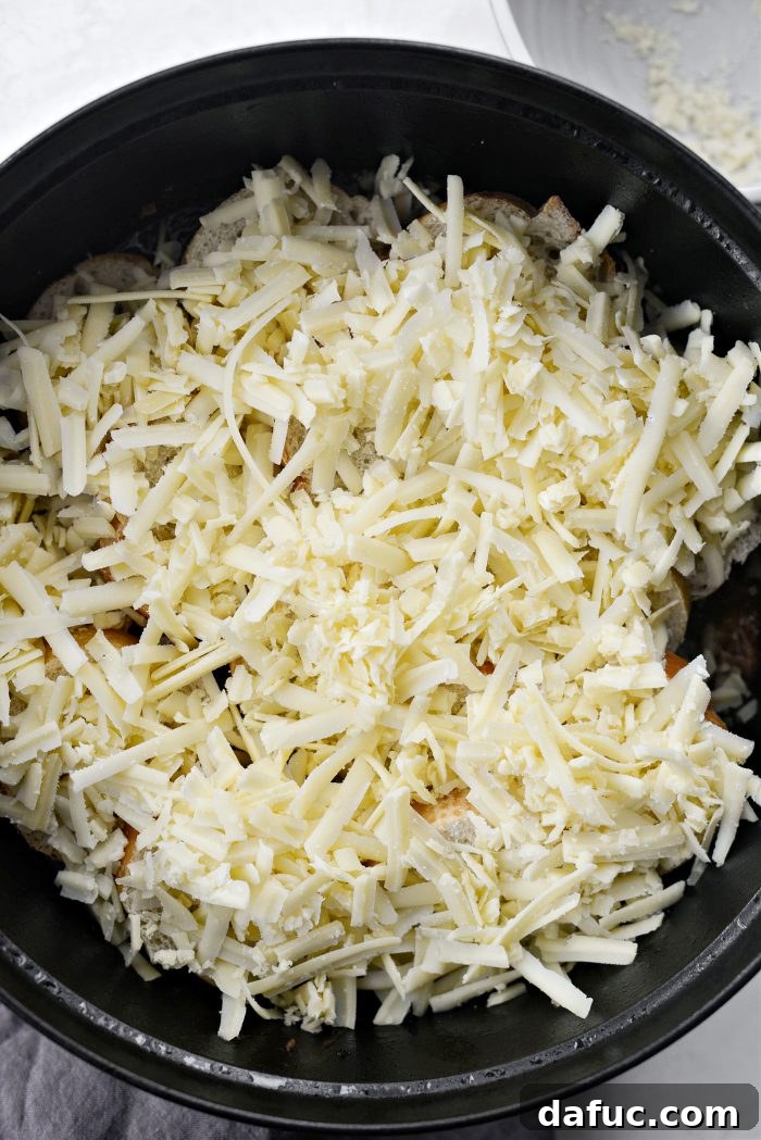 Sweet Onion Braised Beef 23 Sprinkling 8 ounces of freshly grated Gruyere cheese over baguette on the pot roast.