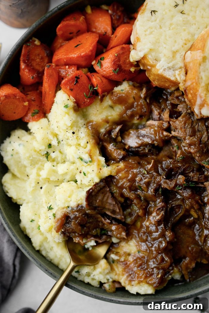 Sweet Onion Braised Beef 26 A hearty serving of French Onion Pot Roast with its golden, cheesy topping.
