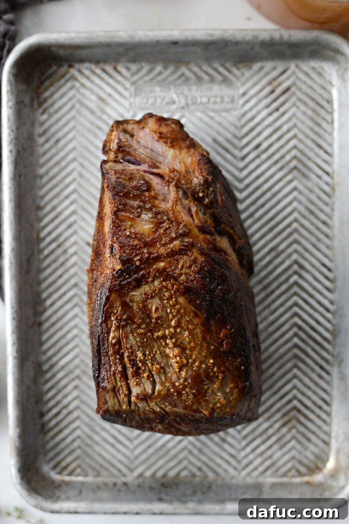 Sweet Onion Braised Beef 8 Transferring the seared chuck roast from the Dutch oven to a clean plate.