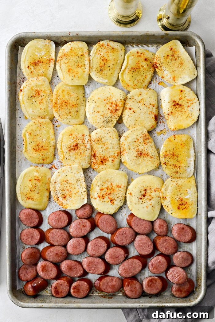 Flipping pierogies and kielbasa after 15 minutes of baking
