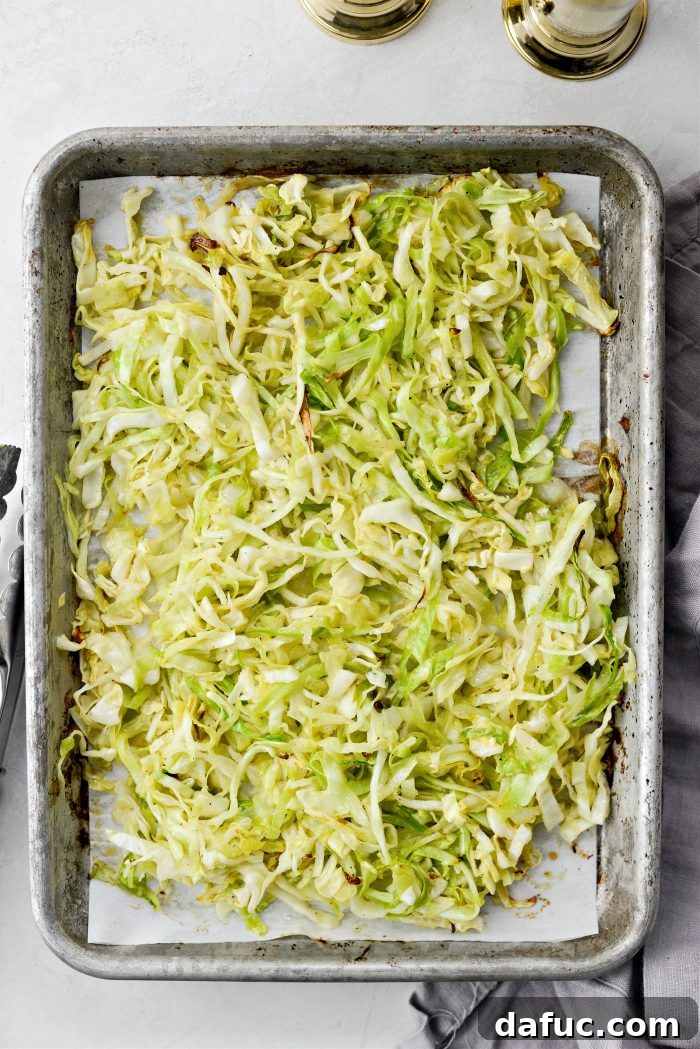 Tossing the cabbage after 15 minutes of baking