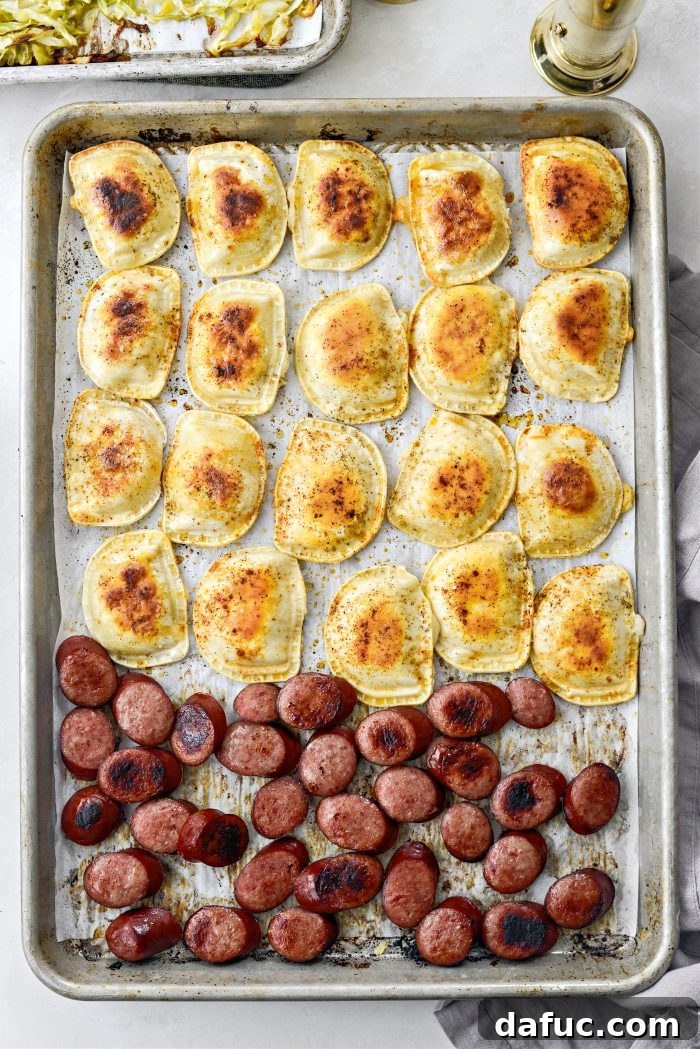 Close-up of golden-brown pierogies and crispy kielbasa