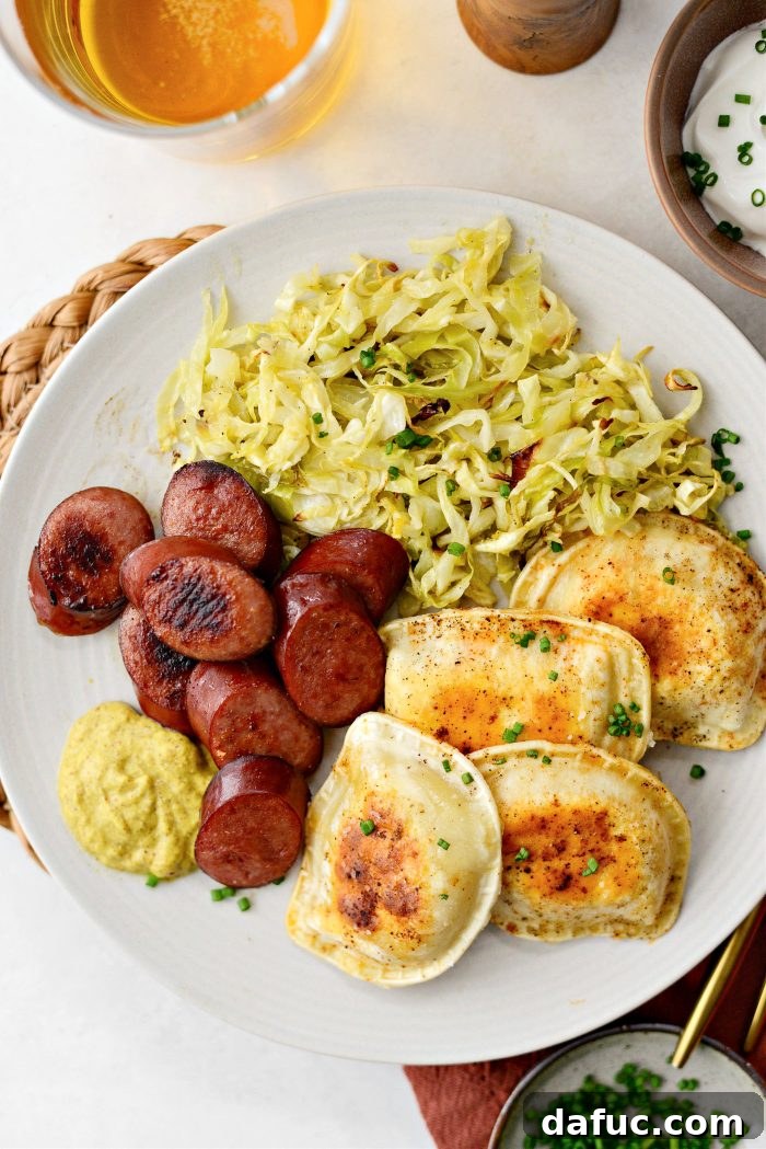 Plated Sheet Pan Pierogies and Kielbasa with condiments