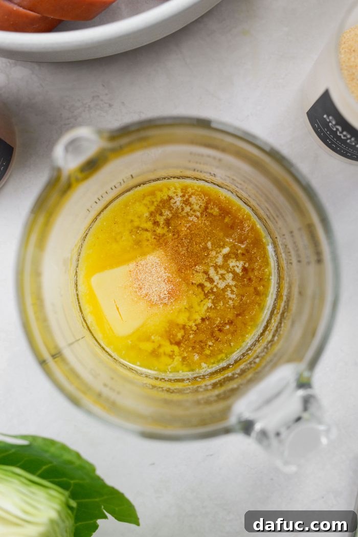 Butter, olive oil, and Better Than Bouillon in a microwave-safe bowl