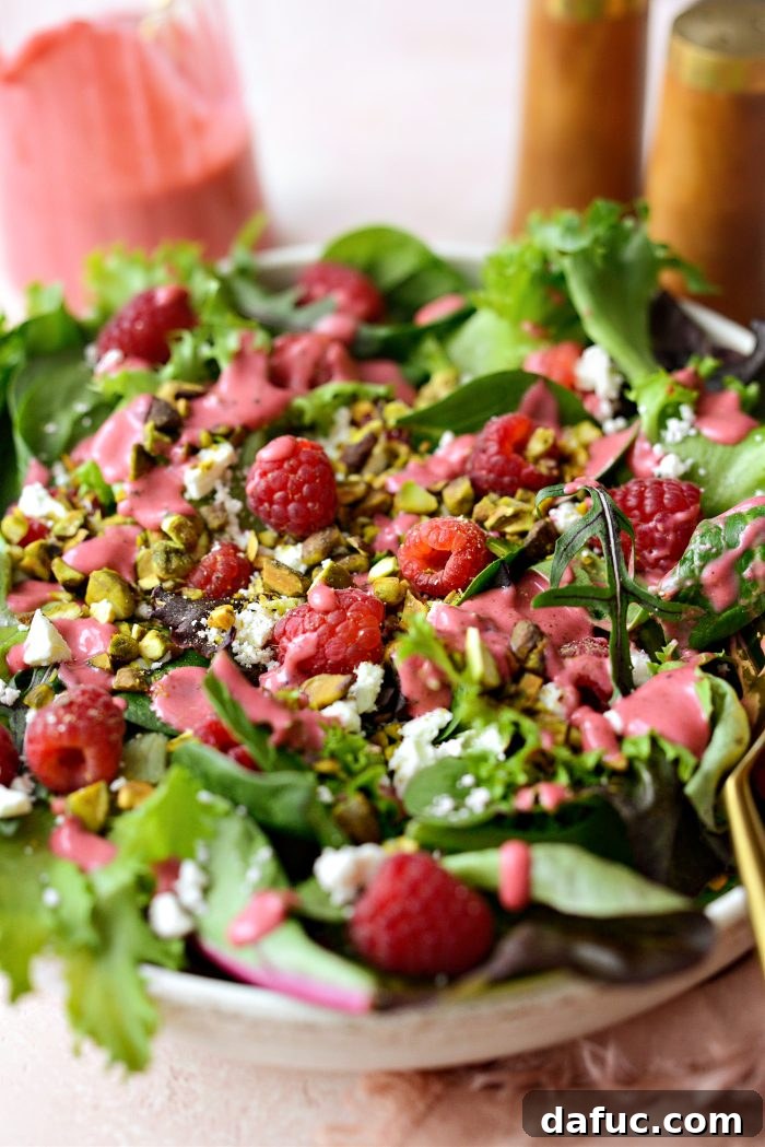 Ruby Red and Green Pistachio Salad 3 Overhead view of a vibrant Raspberry Pistachio Salad in a bowl, showcasing the colorful ingredients