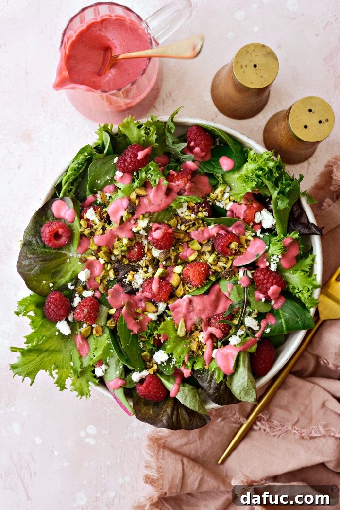 Ruby Red and Green Pistachio Salad 7 A partially assembled Raspberry Pistachio Salad with greens, raspberries, pistachios, and feta added