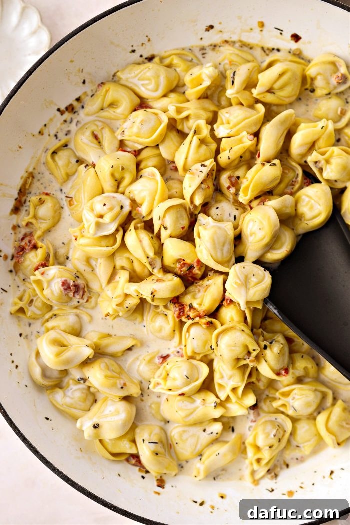 stir and simmer until pasta is cooked and sauce has thickened a bit