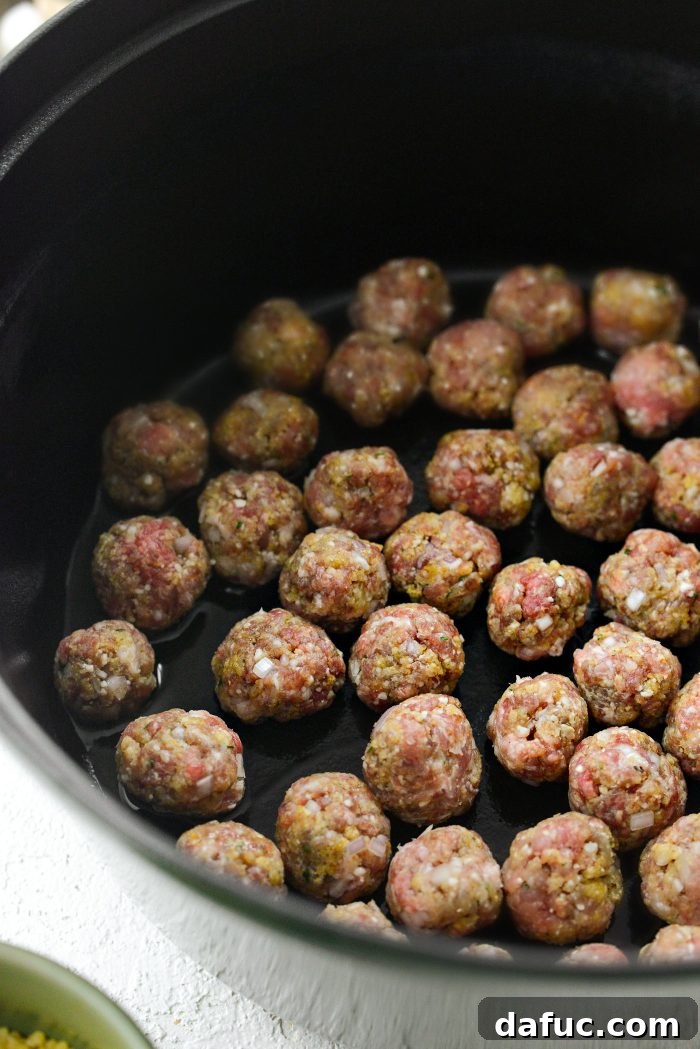 heat oil in large dutch oven and brown meatballs