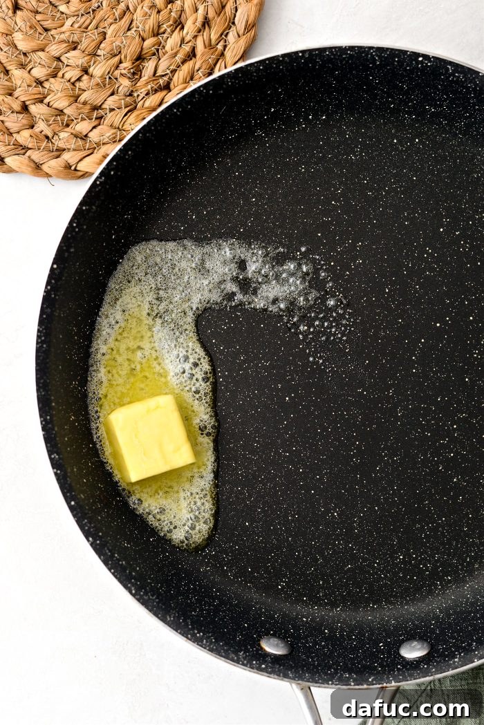 Irish Potato Griddle Cakes 16 Potato farl wedges frying in butter in a nonstick skillet.