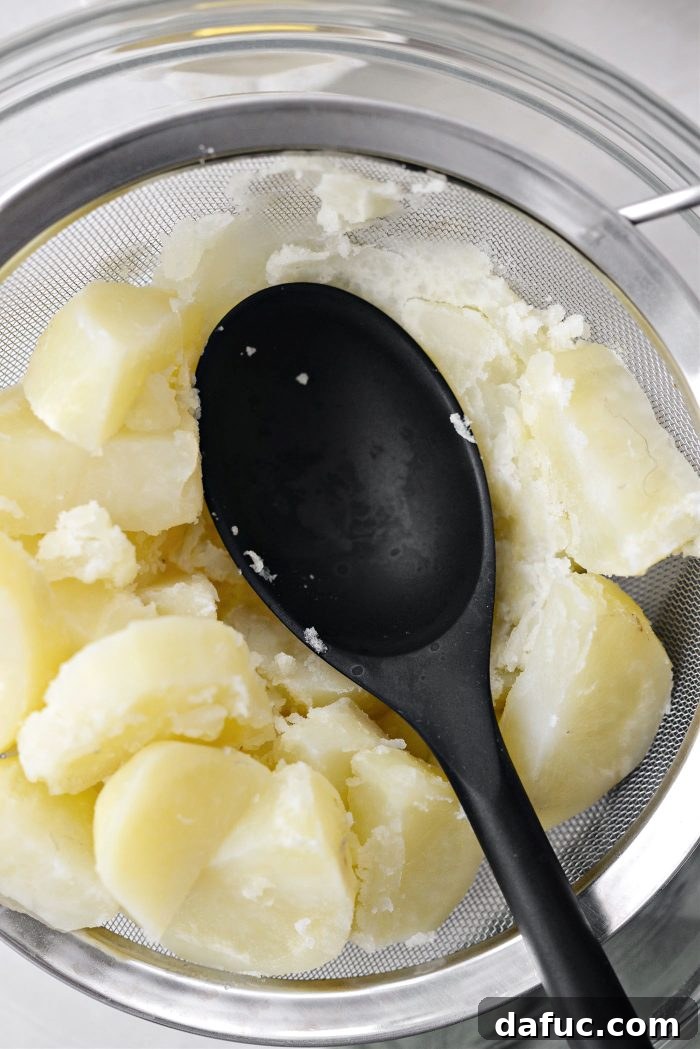 Irish Potato Griddle Cakes 10 All-purpose flour, kosher salt, black pepper, and melted butter added to mashed potatoes in a bowl.