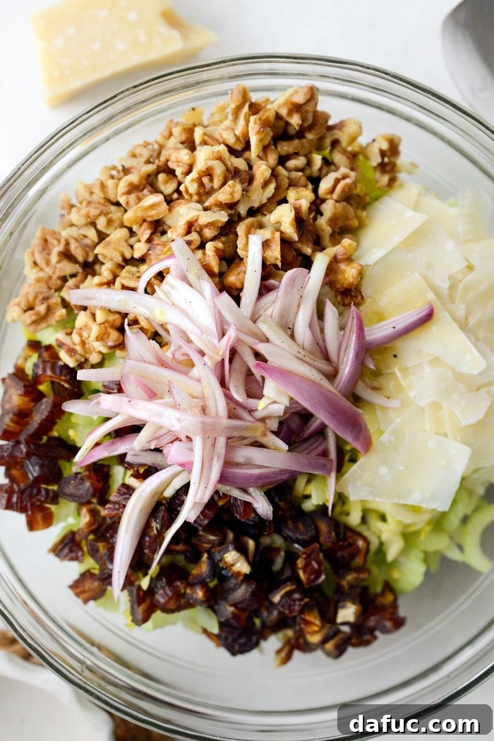 Celery, Date & Parmesan Delight 11 Pouring the zesty lemon shallot dressing over the celery salad ingredients