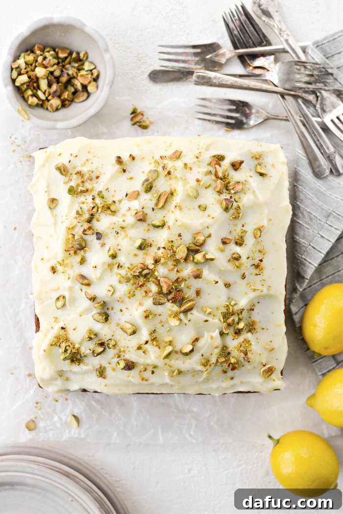 Lemon Pistachio Cake with frosting and garnish