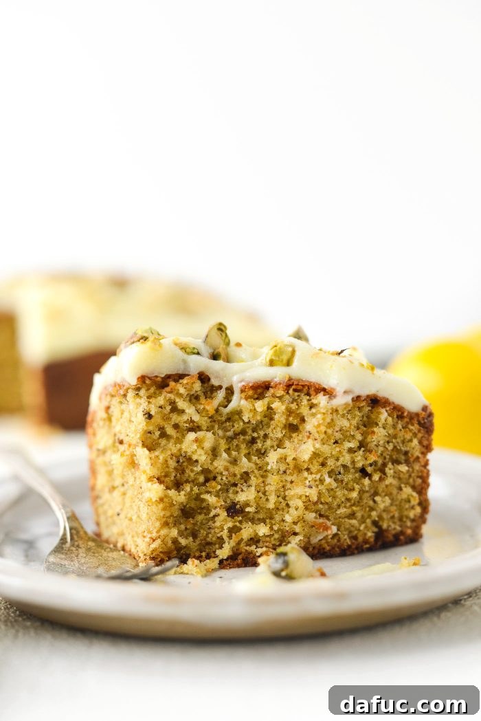 Final overhead view of a complete Lemon Pistachio Cake, ready for serving