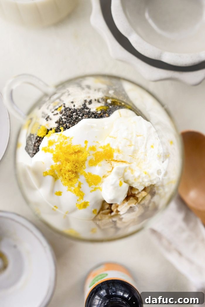 Adding yogurt, cream cheese, lemon zest, maple syrup, and lemon extract to the dry ingredients